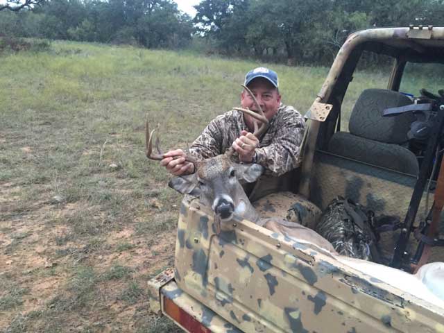Image of Greg Parks with a nice 8 point buck